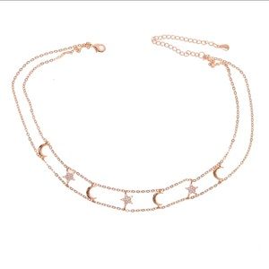 Reach for this moon-star choker when layering on the shimmer.